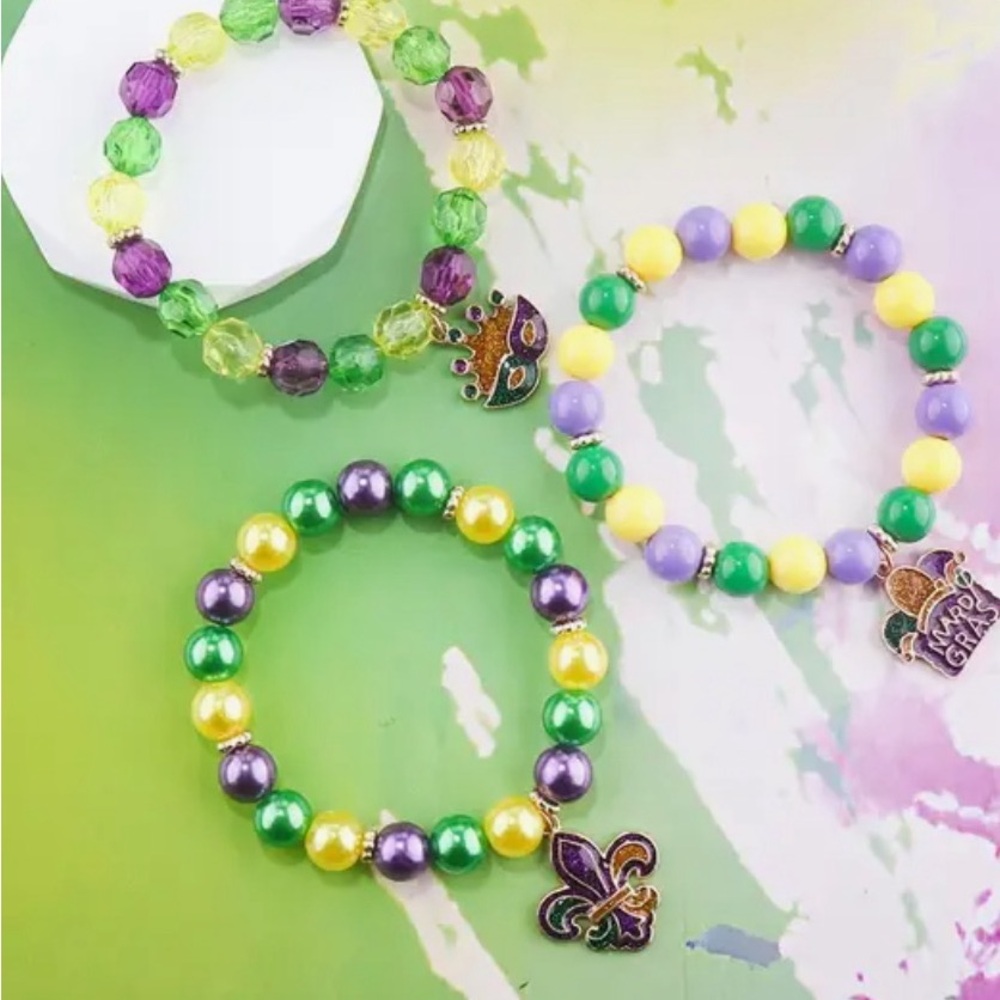 A set of three Mardi Gras bracelets